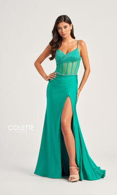 A woman models the Sheer-Bodice Long Collette Prom Dress CL5104, featuring a green sleeveless design with a beaded v-neckline, sheer midriff, high slit, and floor-length skirt against a simple background.