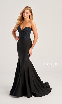 A woman models the Colette Strapless Long Mermaid Prom Dress CL5112, featuring a fitted embellished bodice and dramatic flared train. She stands against a plain background with "Colette by Daphne" shown in the image.