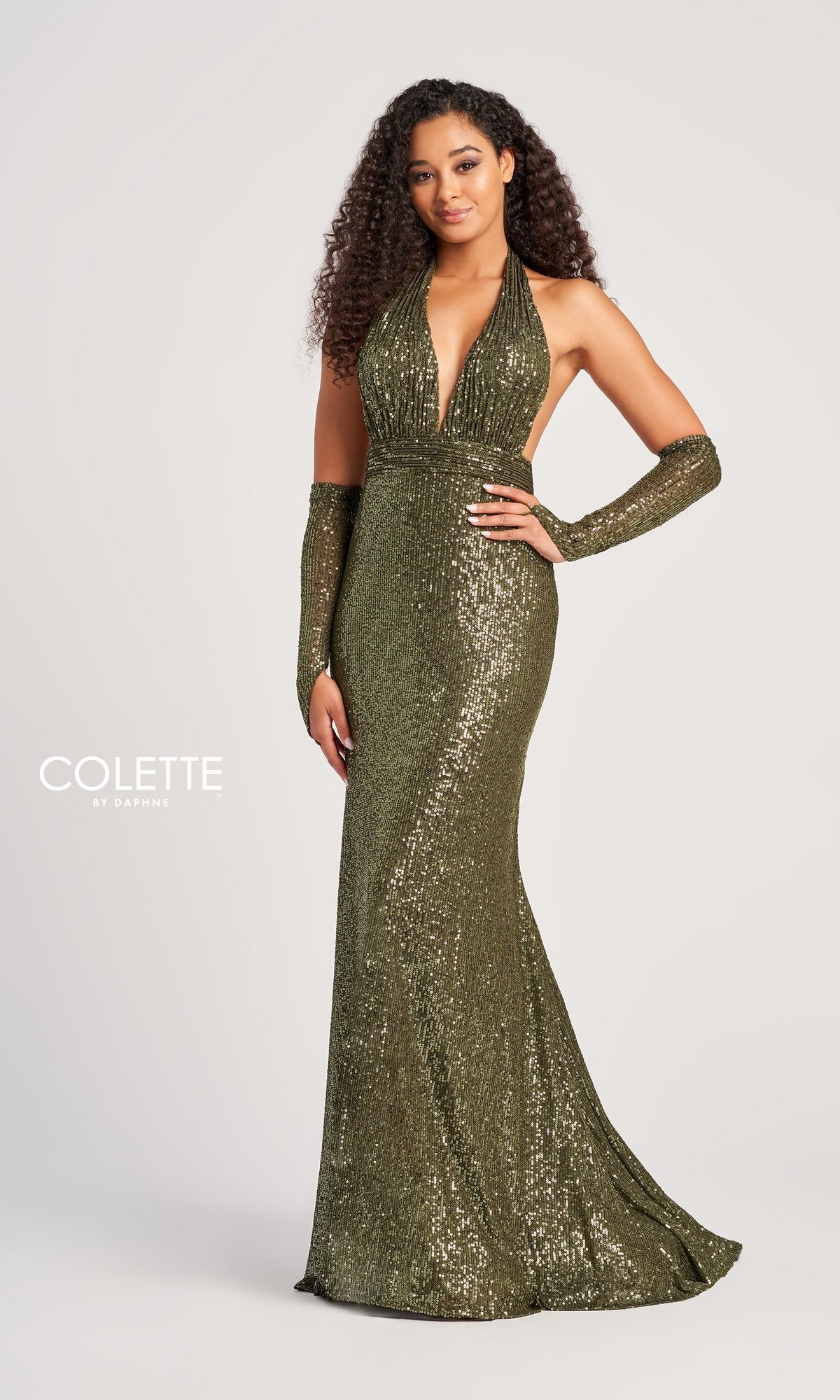 A woman poses against a white background wearing the Colette Long Sequin Halter Prom Dress CL5115—a sparkly, green, floor-length gown with dazzling sequins and matching gloves.