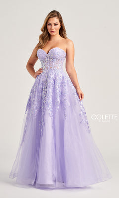 A woman stands against a plain background wearing the Colette Strapless Sweetheart Prom Ball Gown CL5136, a lavender dress with sparkly lace appliqué, floral embellishments, sheer bodice, fitted top, and tulle skirt.