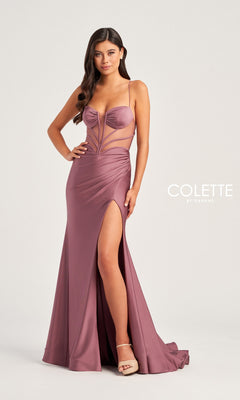 A woman stands against a plain background wearing the Backless Colette Long Designer Prom Dress CL5140—a mauve, floor-length gown with a thigh-high slit, sheer bodice panels, and spaghetti straps.