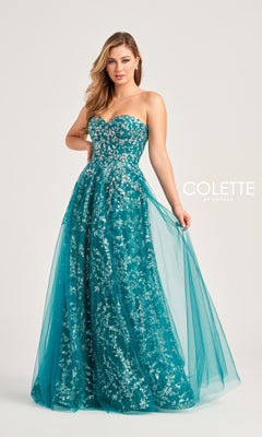 A woman stands holding the side of her teal Colette Strapless Sweetheart Prom Ball Gown CL5144, featuring silver floral embroidery. The "Colette by Daphne" logo appears on the right.
