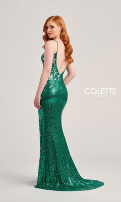 A woman with long red hair models the Colette Backless Long Sequin Prom Dress CL5196, featuring a green hue, thin straps, and shimmering sequins, standing before a plain light background.