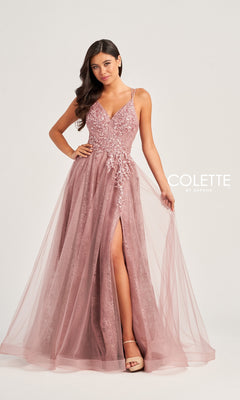 A woman poses against a plain background wearing the Glitter-Lace Colette Long Prom Ball Gown CL5197, a mauve, floor-length A-line dress with beaded-lace floral applique, V-neckline, high slit, and tulle overlay.