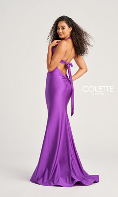 A woman with curly hair models the Colette Front-Knot Long Halter Prom Dress CL5199—an elegant, floor-length, purple spandex jersey gown featuring a halter neck, side bow, and backless design. "COLETTE BY DAPHNE" appears at right.