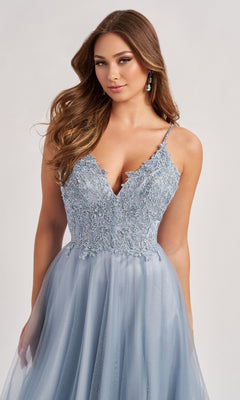 A woman poses against a neutral background in the Colette CL8190 long prom dress—light blue, sleeveless, with spaghetti straps, a fitted sequin bodice, and an elegant lace and tulle A-line skirt.