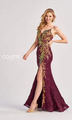 A woman poses and smiles against a plain background wearing the Colette CL8425, a sleeveless, floor-length prom dress with floral sequin appliqué, thigh-high slit, and shimmering sequins.