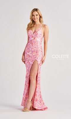 A woman in the Long Prom Dress: Colette CL8465, a pink sequin gown with thin straps, sparkling floral pattern, and thigh-high slit, pairs it with beige heels while standing against a plain background.