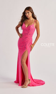 A woman poses in the Bead-Adorned Long Prom Dress: Colette CL8510, featuring a bright pink hue, sweetheart neckline, thin straps, thigh-high slit, intricate beading, and a slight train against a plain background.