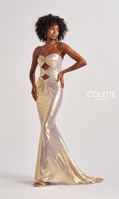 A woman poses against a white background in the Long Prom Dress: Colette CL8545—a strapless, metallic gold cut-out gown that is fitted, floor-length, and glamorous. The "COLETTE by Daphne" logo is visible.