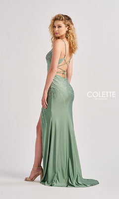 A woman in the Colette CL8555 long prom dress stands sideways, looking over her shoulder. The light green gown is floor-length with a side slit, strappy back, and beaded embellishments for extra shimmer.