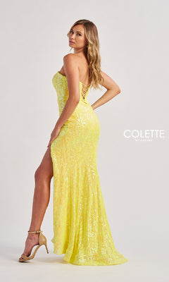 A woman poses sideways in heels against a plain light background, wearing the Colette CL8610 long prom dress featuring a strapless sequined bodice, thigh-high slit, and lace-up back.