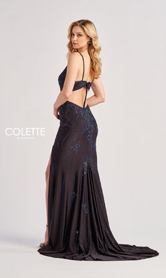 A woman poses in a studio wearing the dark blue, floor-length Colette by Daphne Long Prom Dress CL8620, featuring beaded sequins, an open back, and a side slit. The "Colette by Daphne" logo appears in the shot.