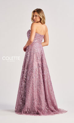 A woman wears the Colette CL8625, a long prom dress in lavender with strapless design and intricate sequin and bead detailing, posing against a plain background.