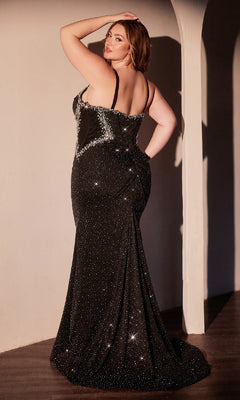 A woman poses with her back to the camera in the Ladivine CM365C, a plus-size long black prom dress with beaded silver detailing, standing in a softly lit room.