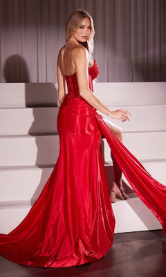 A woman in the Strapless Long Corset Prom Dress: Ladivine CM369 with a high slit stands on white steps, glancing back over her shoulder.