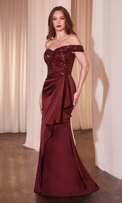A woman stands before white curtains wearing the Off-Shoulder Draped Long Prom Gown Ladivine CR877 in deep red, featuring a beaded sequin bodice and a flowing skirt.