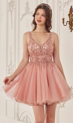 A woman in the Lace-Up Short A-Line Homecoming dress CY022, featuring a blush pink tone and beaded bodice, stands in an ornate room with white walls and gold decor.