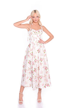 A woman models the Ivory Blush Floral Midi Casual Dress: Cecilia with a corset-style bodice and spaghetti straps, paired with open-toe heels, standing against a plain white background.