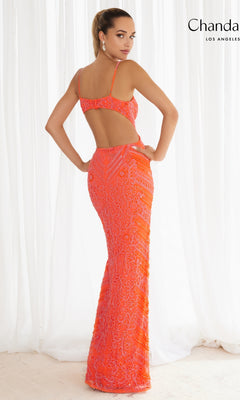A woman stands with her back to the camera wearing Chandalier's Long Prom Dress 30129—a bright orange beaded formal gown with thin straps and an open back.