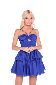 Woman with long blonde hair wears the Navy Short Casual Dress: Corinne—a sleeveless, layered summer dress with lace trim and a smocked bodice—while standing against a plain white background.