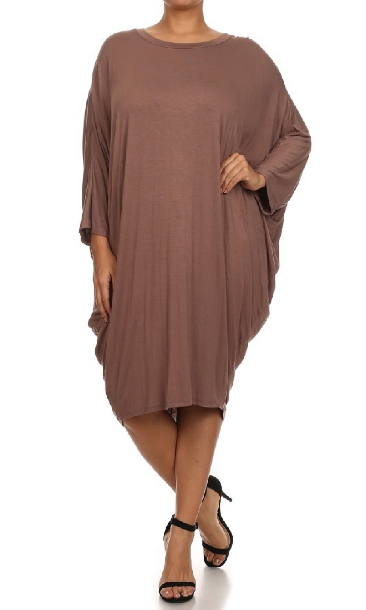 A person is wearing a Short Casual Plus Size Dress with Dolman Sleeves in brown and black heeled sandals, posing against a white background.