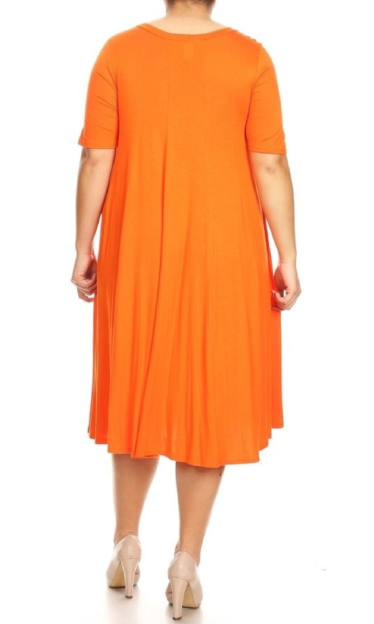 A person is shown from the back wearing a Plus-Size Jersey Knit Oversized A-Line Casual Dress in orange, knee-length with short sleeves, paired with nude heels against a white background.