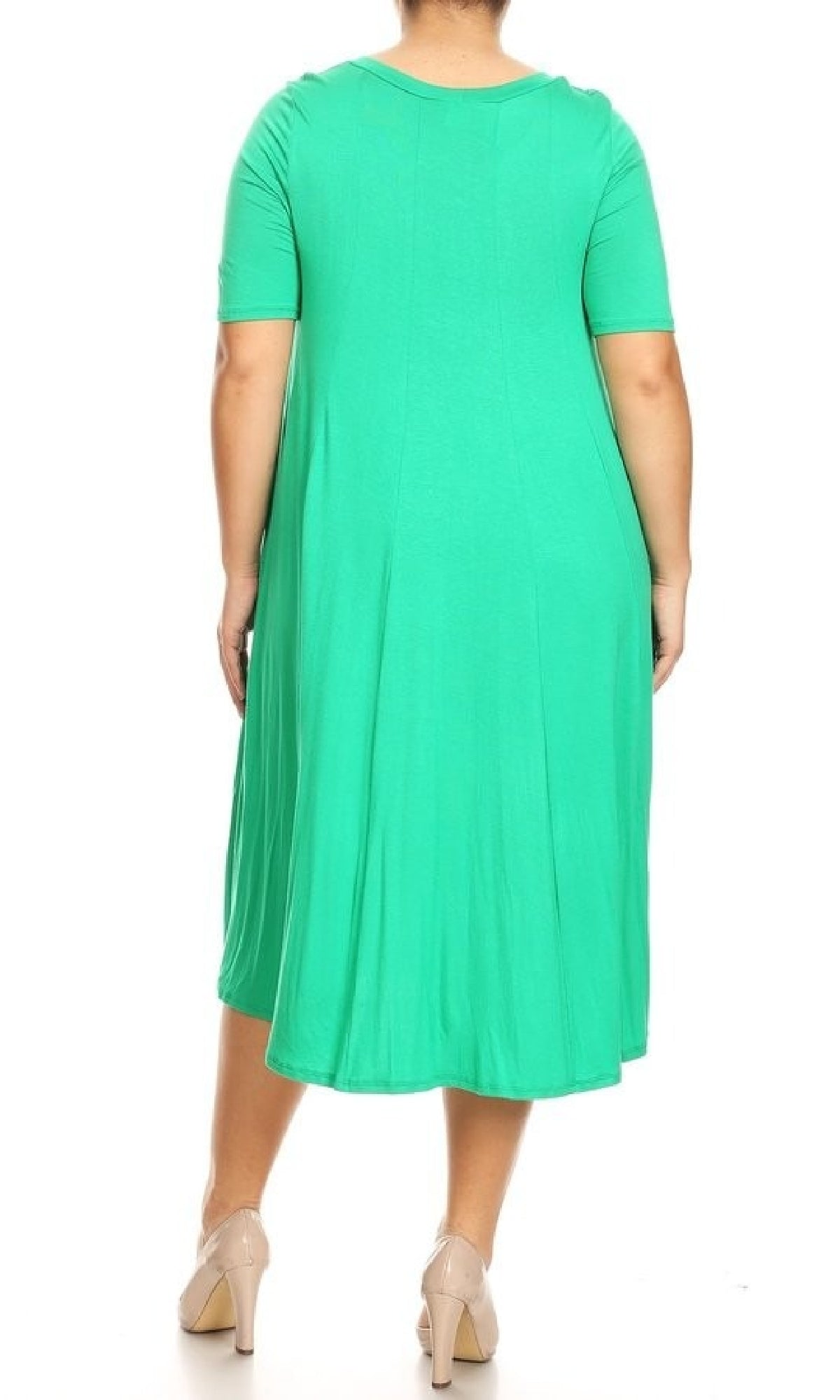 A person is shown from the back wearing the Plus-Size Jersey Knit Oversized A-Line Casual Dress in bright green with nude heels, set against a white background.