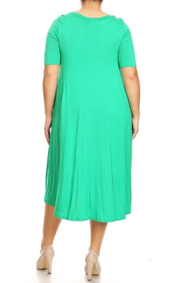 A person is shown from the back wearing the Plus-Size Jersey Knit Oversized A-Line Casual Dress in bright green with nude heels, set against a white background.