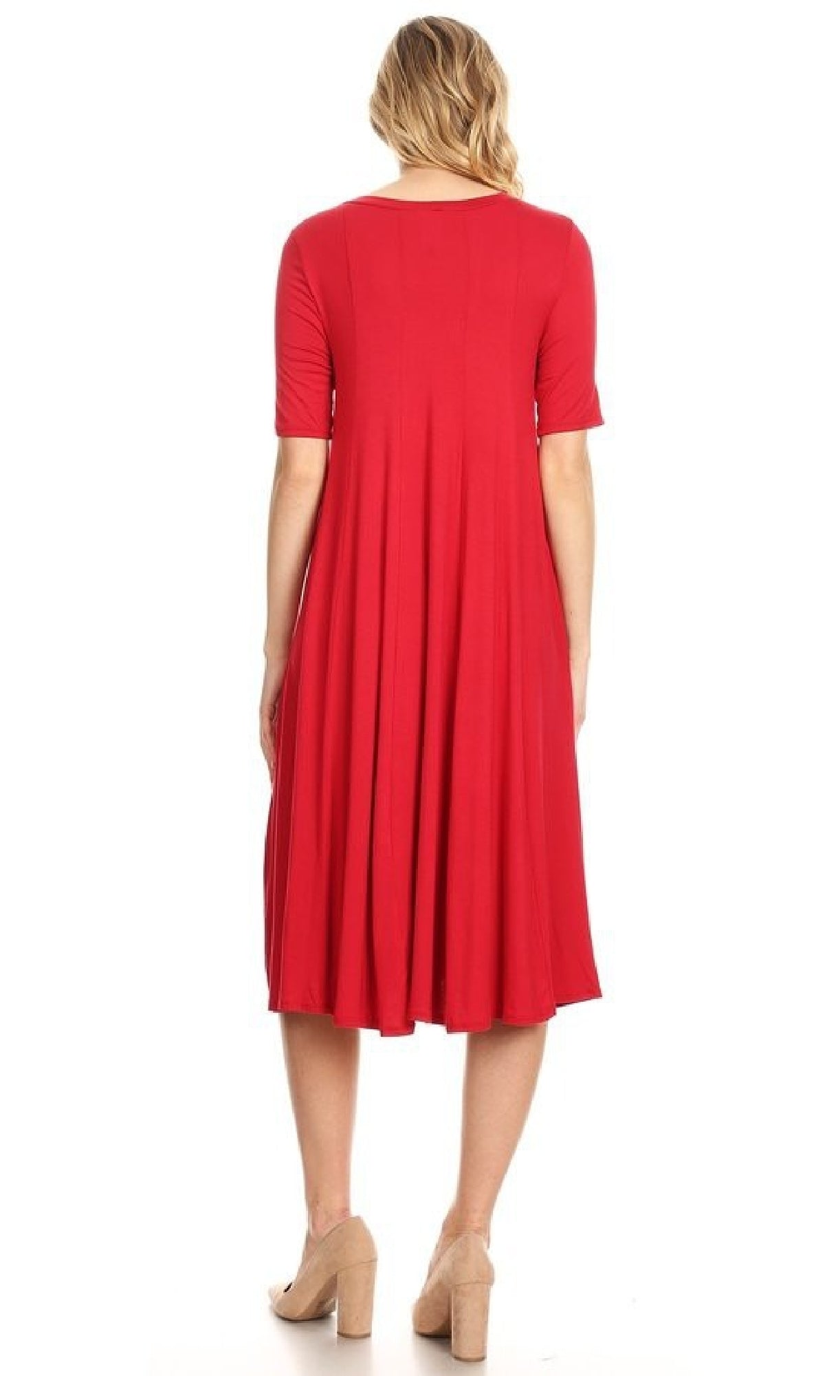 A woman stands facing away against a white background, wearing the Short Sleeve Casual Oversized Jersey Knit Dress in red, knee-length, with short sleeves and beige heeled shoes.