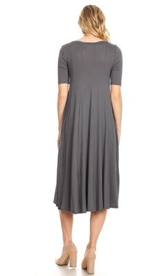 A woman stands with her back to the camera, wearing a Short Sleeve Casual Oversized Jersey Knit Dress in gray and beige high-heeled shoes, set against a plain white background.