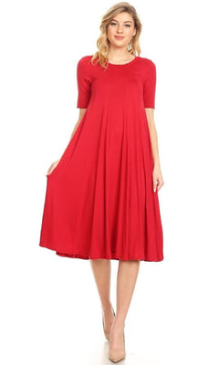 A woman wearing a Short Sleeve Casual Oversized Jersey Knit Dress in bright red with beige high heels stands against a plain white background.