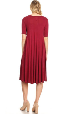 A woman is shown from the back wearing a knee-length, short sleeve red Short Sleeve Casual Oversized Jersey Knit Dress with nude heels, set against a white background.