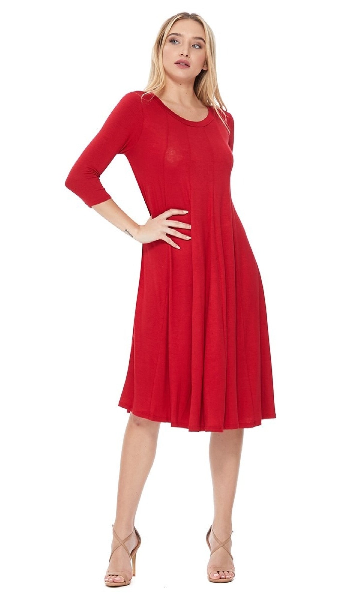 A woman stands confidently against a white background in a Knee-Length Casual Party Dress paired with three-quarter sleeves and beige high-heeled sandals.