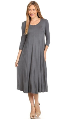 Woman dressed in a knee-length, long-sleeve gray Knee-Length Casual Party Dress and beige strappy heels, standing against a plain white background.