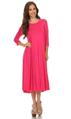 A woman stands smiling against a white background, wearing the Knee-Length Casual Party Dress in bright pink with long sleeves, paired with tan high-heeled sandals.