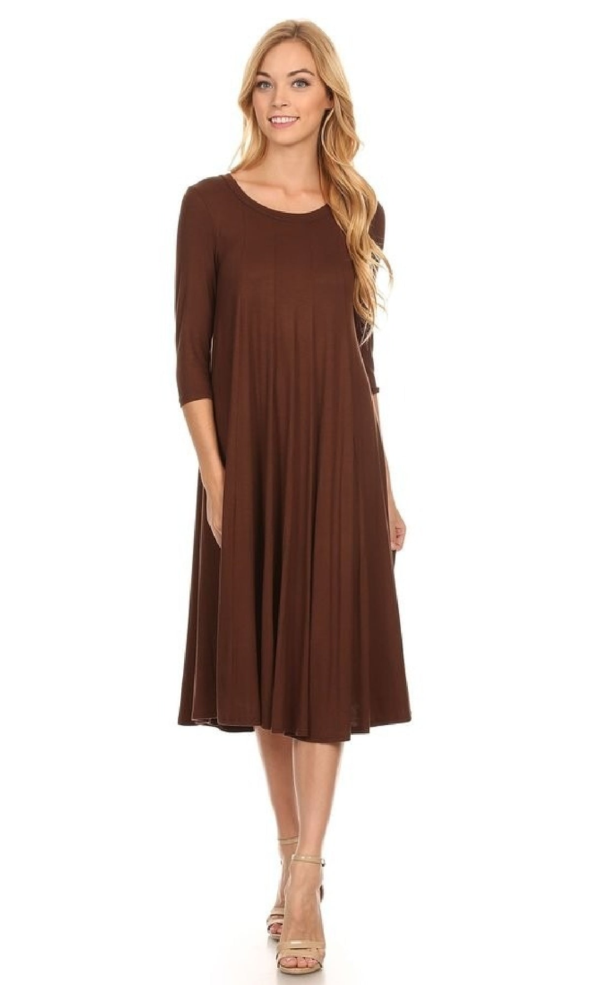 A woman models the Knee-Length Casual Party Dress with three-quarter sleeves and beige heels, standing against a plain white background.