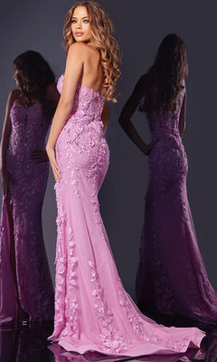 A woman wearing the Jovani D5107 long prom dress, strapless and floor-length in pink with 3D floral details, poses with her back to the camera beside her reflection in a mirror.