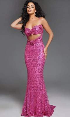 A woman poses in the Hot Pink Strapless Sequin Prom Gown: Jovani D5403, a fitted, floor-length dress featuring a front cutout and bow details, set against a plain gray background.