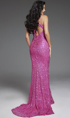 A woman with long dark hair models the Jovani D5403 Hot Pink Strapless Sequin Prom Gown, standing and facing away to highlight its dramatic back design and elegant train.