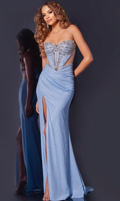 A woman in the Jovani D5414 long prom dress—strapless, blue, with a high slit, rhinestone details, and sheer side panels—stands against a dark background, highlighting the gown's elegance.