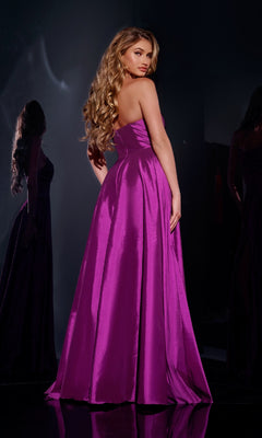 A woman with long wavy hair wears the Jovani D5822 long prom dress in vibrant purple, standing with her back turned and looking over her shoulder.
