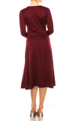 A woman faces away from the camera, wearing a burgundy Faux-Wrap Casual Short Dress with Sleeves and clear high-heeled shoes.