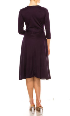 A person is shown from the back against a white background wearing the Faux-Wrap Casual Short Dress with Sleeves in purple and clear-heeled shoes.