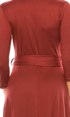 Model wearing the Faux-Wrap Casual Short Dress with Sleeves in rust, featuring long sleeves, a fabric belt, and knee-length hem, shown from the back.