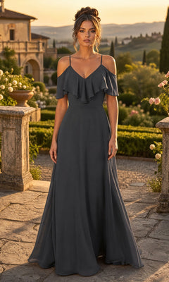A woman stands outdoors in a garden at sunset, wearing the Chicas DM4004 Long Formal Dress in charcoal, featuring an off-the-shoulder design with ruffle detailing.