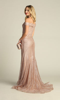 A woman poses gracefully against a plain light background, holding a small clutch and wearing the Off-the-Shoulder Long Prom Dress: Chicas DM4024 with a shimmering mermaid silhouette, her back slightly turned from the camera.