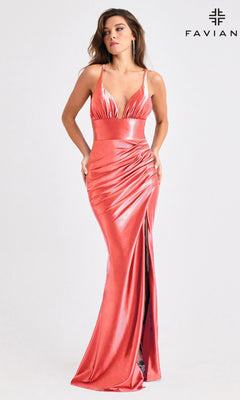 A woman models the Faviana E11423 long pink satin prom dress with a deep neckline, leg slit, and sleeveless floor-length design. She stands before a plain background with the "FAVIAN" logo in the top right corner.