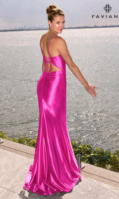 A woman in a lipstick-colored Faviana E11648 satin corset prom dress with a lace-up back stands by a waterfront.