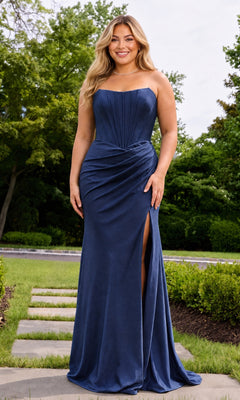 A woman wears a navy Long Plus-Size Prom Dress: Faviana E11659E, a floor-length strapless charmeuse gown with a pleated corset bodice and a high thigh slit.